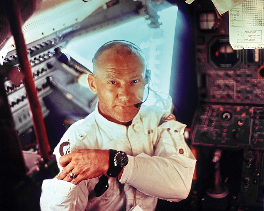 Aldrin: This picture is actually en route, with the command module and the lunar module. We had to separate from the upper stage and turn around and dock with the lunar module. There was a period when I had to go through the tunnel as we were approaching the moon and that’s why I have this garment that we wore inside the command module and for my inspection of the lunar module. While I was doing that, wearing the Omega watch, Neil put his head down through the tunnel, upside down, and took this picture of me.
